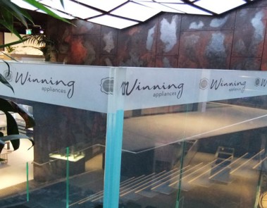 Winnings signage using Montage insert in decorative glass